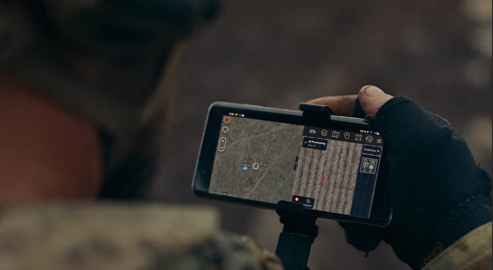 The client's technology shown on an AI-generated handheld device in a field setting